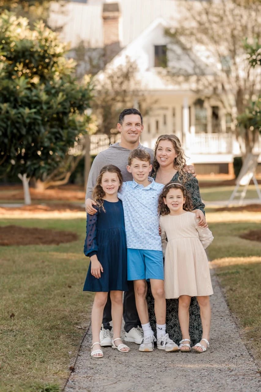 Jayce Stewart with his wife and three children outside a Lowcountry home